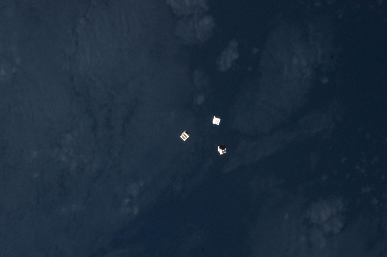 ISS033-E-009334 (4 Oct. 2012) --- Several tiny satellites are featured in this image photographed by an Expedition 33 crew member on the International Space Station. The satellites were released outside the Kibo laboratory using a Small Satellite Orbital Deployer attached to the Japanese module’s robotic arm on Oct. 4, 2012. Japan Aerospace Exploration Agency astronaut Aki Hoshide, flight engineer, set up the satellite deployment gear inside the lab and placed it in the Kibo airlock. The Japanese robotic arm then grappled the deployment system and its satellites from the airlock for deployment.