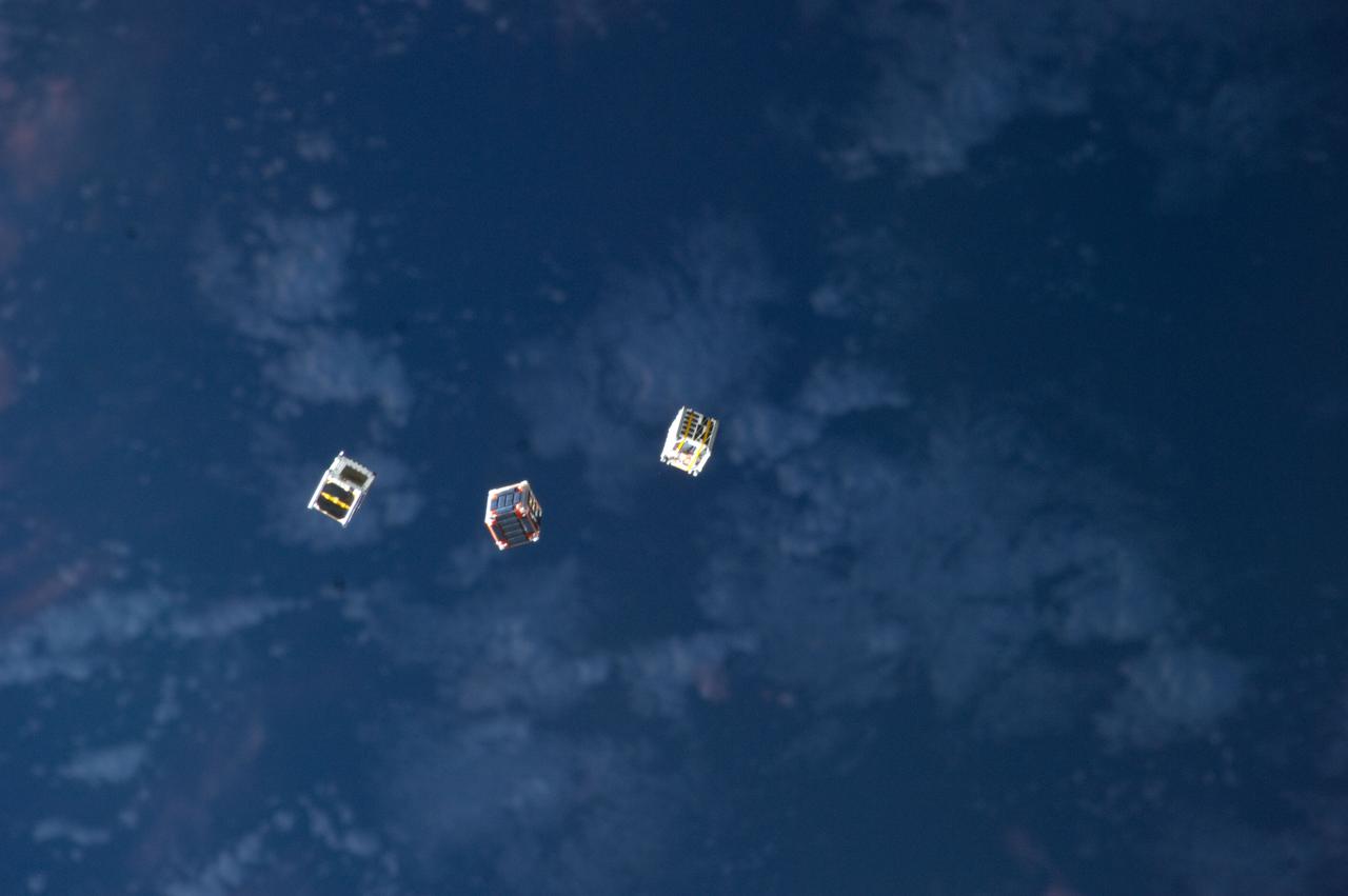 ISS033-E-009458 (4 Oct. 2012) --- Several tiny satellites are featured in this image photographed by an Expedition 33 crew member on the International Space Station. The satellites were released outside the Kibo laboratory using a Small Satellite Orbital Deployer attached to the Japanese module’s robotic arm on Oct. 4, 2012. Japan Aerospace Exploration Agency astronaut Aki Hoshide, flight engineer, set up the satellite deployment gear inside the lab and placed it in the Kibo airlock. The Japanese robotic arm then grappled the deployment system and its satellites from the airlock for deployment.