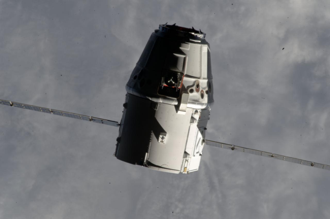 ISS033-E-011551 (10 Oct. 2012) --- The SpaceX Dragon commercial cargo craft makes its relative approach to the International Space Station prior to grapple by the station’s Canadarm2 robotic arm, controlled by Expedition 33 crew members.