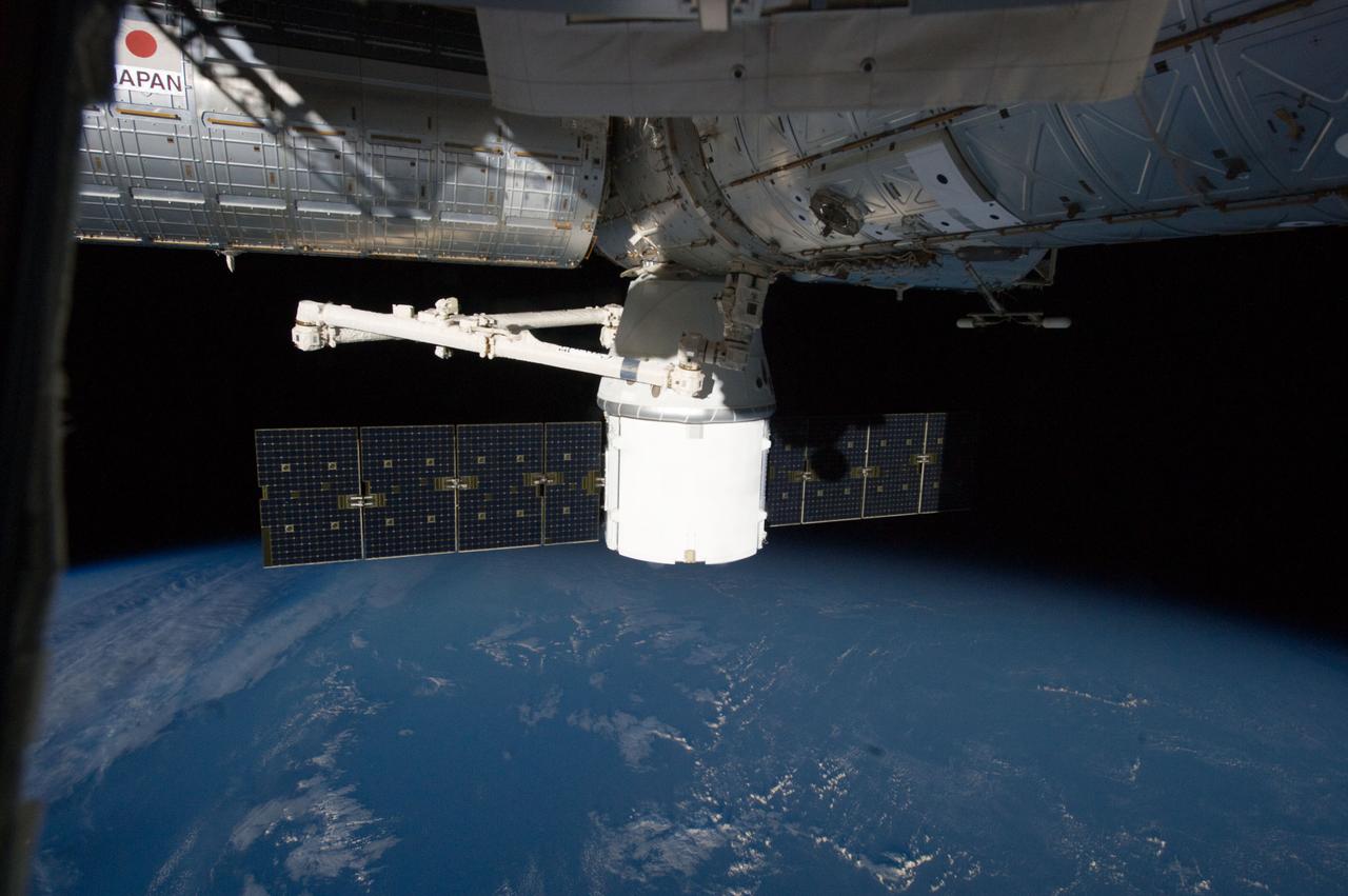 ISS033-E-012422 (14 Oct. 2012) --- Attached to the Earth-facing side of the Harmony node, the SpaceX Dragon commercial cargo craft is featured in this image photographed by an Expedition 33 crew member on the International Space Station. Dragon was berthed to Harmony on Oct. 10 and is scheduled to spend 18 days attached to the station.