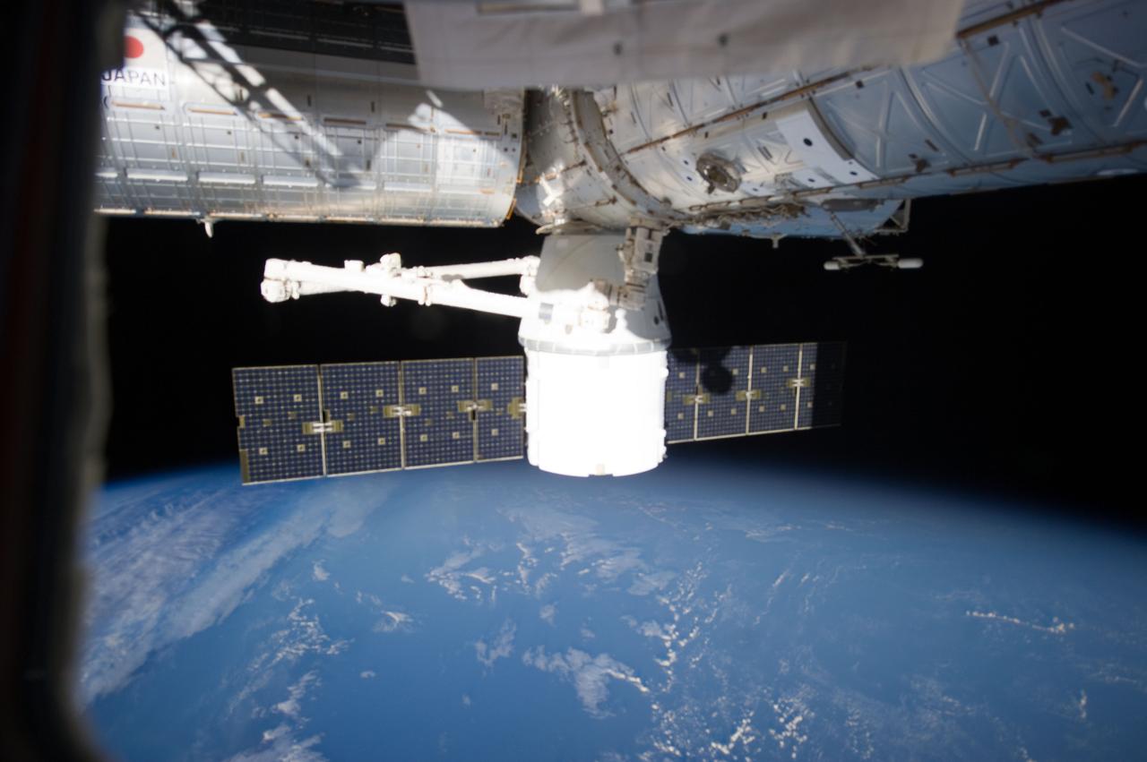 ISS033-E-012424 (14 Oct. 2012) --- Attached to the Earth-facing side of the Harmony node, the SpaceX Dragon commercial cargo craft is featured in this image photographed by an Expedition 33 crew member on the International Space Station. Dragon was berthed to Harmony on Oct. 10 and is scheduled to spend 18 days attached to the station.