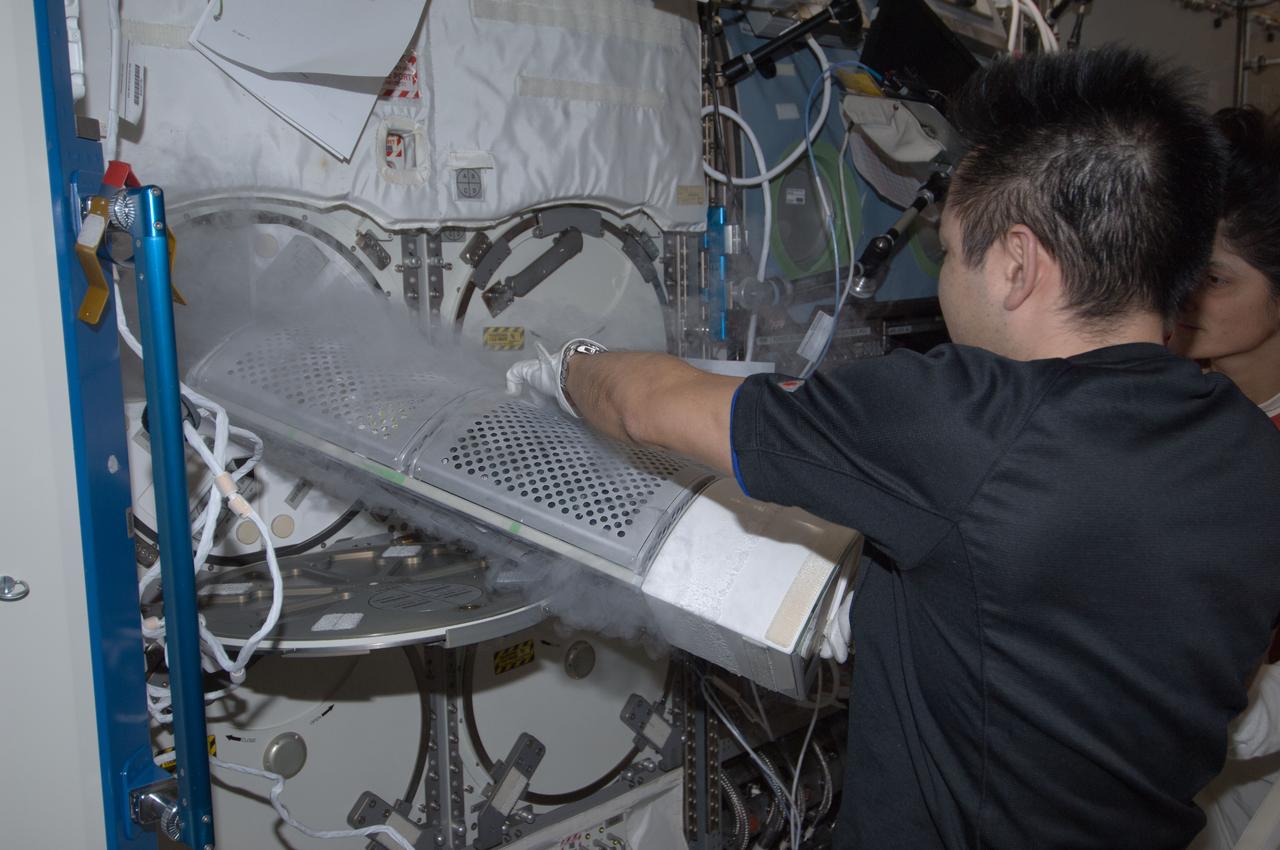 ISS033-E-016183 (26 Oct. 2012) --- Japan Aerospace Exploration Agency astronaut Aki Hoshide, Expedition 33 flight engineer, services the Minus Eighty Laboratory Freezer for ISS-2 (MELFI-2) in the Destiny laboratory of the International Space Station.