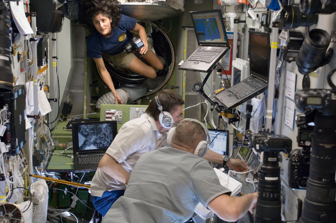 ISS033-E-016948 (31 Oct. 2012) --- Russian cosmonauts Yuri Malenchenko and Oleg Novitskiy, both Expedition 33 flight engineers, monitor data at the manual TORU docking system controls in the Zvezda Service Module of the International Space Station during approach and docking operations of the unpiloted ISS Progress 49 resupply vehicle. Progress 49 docked automatically to Zvezda’s aft port at 9:33 a.m. (EDT) on Oct. 31, 2012. NASA astronaut Sunita Williams, commander, is visible at top left.