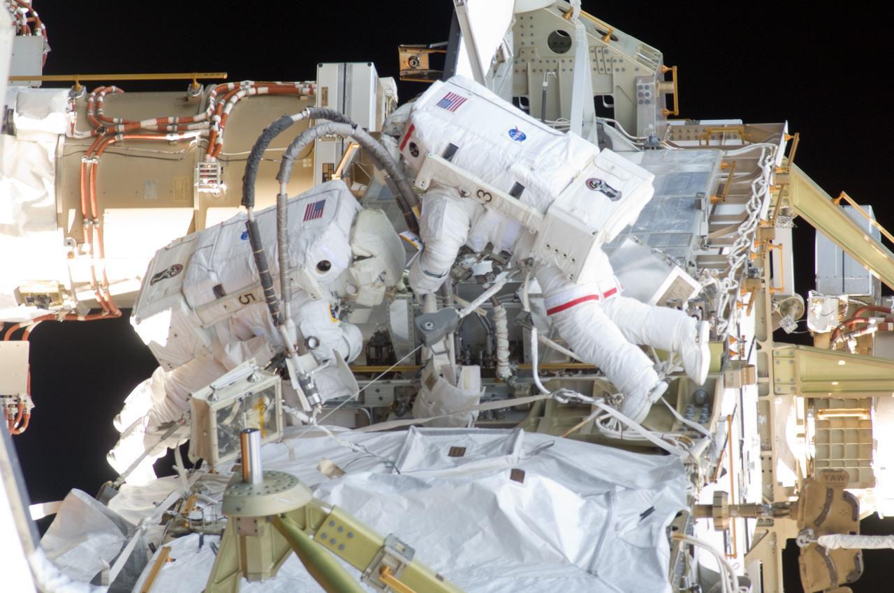 ISS033-E-017354 (1 Nov. 2012) --- NASA astronaut Sunita Williams (right), Expedition 33 commander; and Japan Aerospace Exploration Agency astronaut Aki Hoshide, flight engineer, participate in a session of extravehicular activity (EVA) outside the International Space Station on Nov. 1, 2012. During the six-hour, 38-minute spacewalk, Williams and Hoshide ventured outside the orbital outpost to perform work and to support ground-based troubleshooting of an ammonia leak.