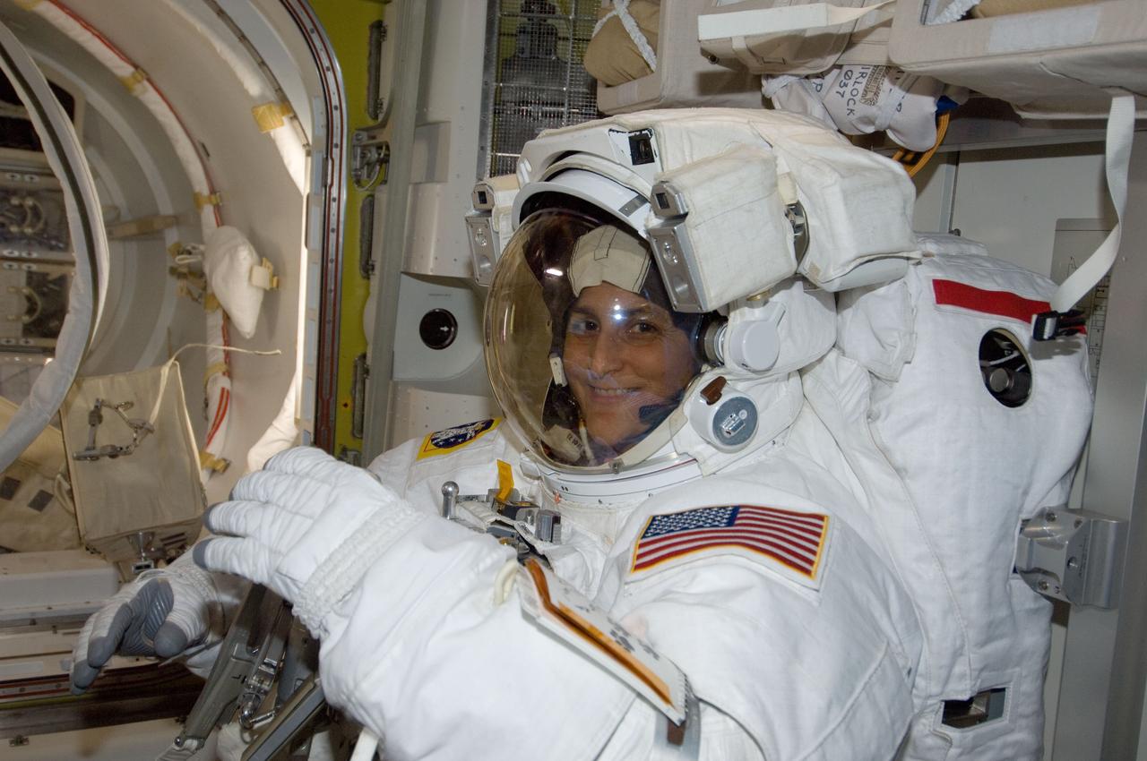 ISS033-E-018379 (1 Nov. 2012) --- NASA astronaut Sunita Williams, Expedition 33 commander, is pictured in the Quest airlock of the International Space Station as she prepares for the start of a session of extravehicular activity (EVA) outside the International Space Station on Nov. 1, 2012. Williams is wearing an Extravehicular Mobility Unit (EMU) spacesuit.