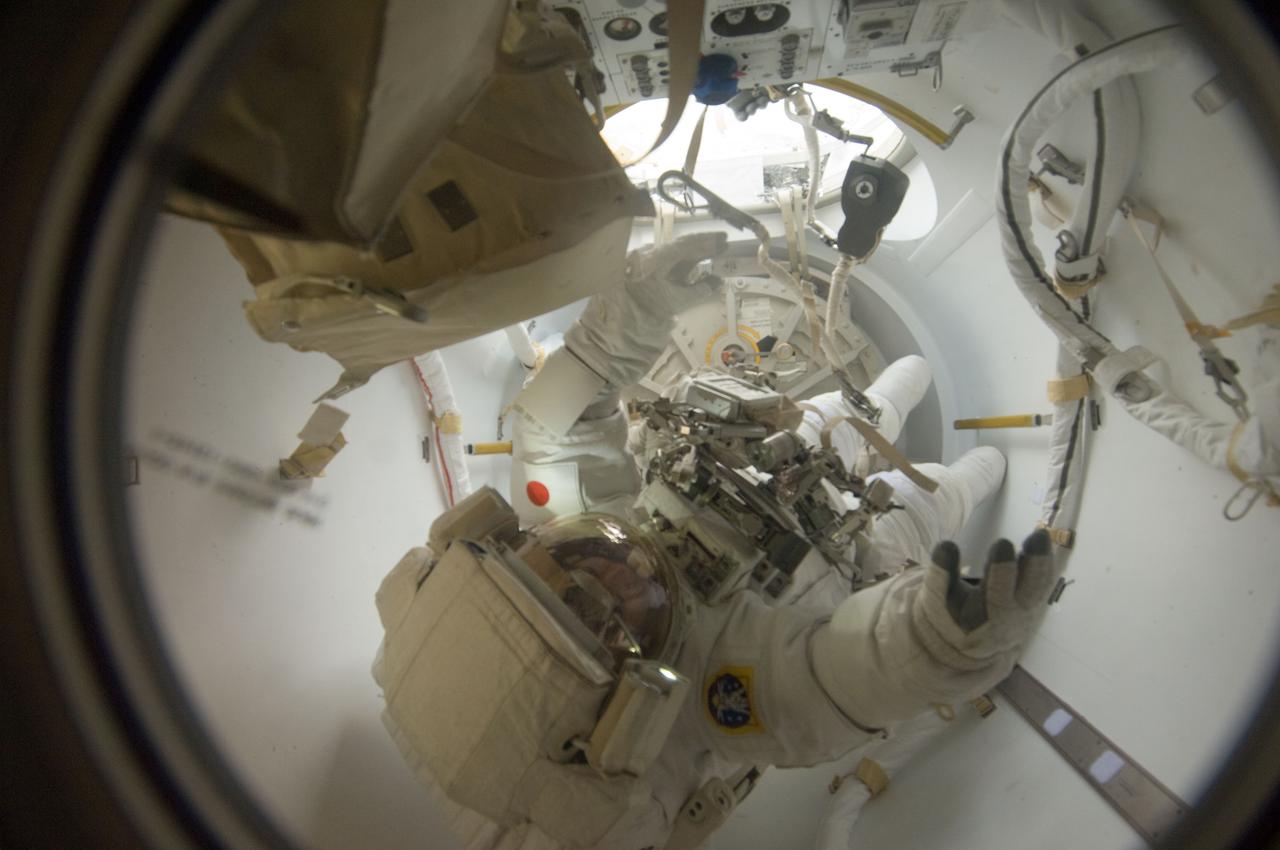 ISS033-E-018472 (1 Nov. 2012) --- Japan Aerospace Exploration Agency astronaut Aki Hoshide, Expedition 33 flight engineer, enters the International Space Station's Quest airlock as the session of extravehicular activity (EVA) draws to a close.