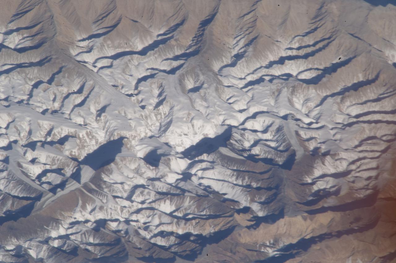 ISS033-E-019708 (9 Nov. 2012) --- One of the Expedition 33 crew members aboard the International Space Station exposed this high oblique image of Saser Muztagh, in the Karakoram Range of the Kashmir region of India centered 34.9 degrees north latitude and 77.8 degrees east longitude.  The view is in mid-afternoon light looking northeastward from a nadir point in north central Pakistan about 100 miles west of Lahore.