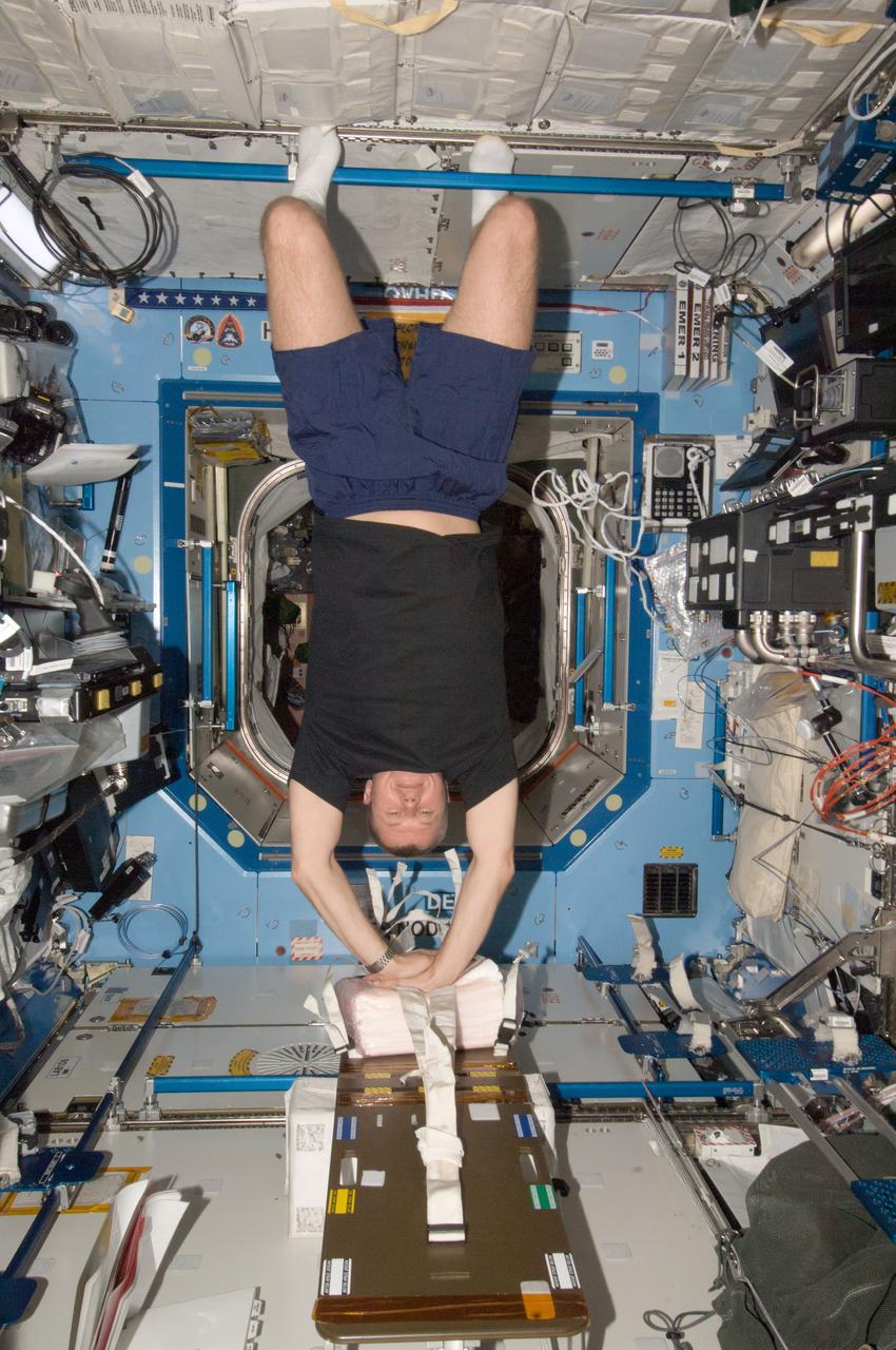 ISS034-E-005260 (26 Nov. 2012) --- Russian cosmonaut Oleg Novitskiy, Expedition 34 flight engineer, participates in a Crew Health Care System (CHeCS) medical contingency drill in the Destiny laboratory of the International Space Station. This drill gives crew members the opportunity to work as a team in resolving a simulated medical emergency onboard the space station.