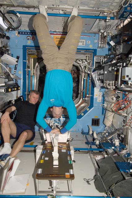NASA image: Novitskiy and Tarelkin both participate in a CHeCS medical contingency drill in the U.S. Laboratory