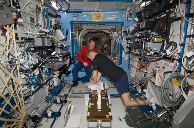 NASA image: Ford and Novitskiy participate in a CHeCS Medical Contingency Drill in the U.S. Laboratory