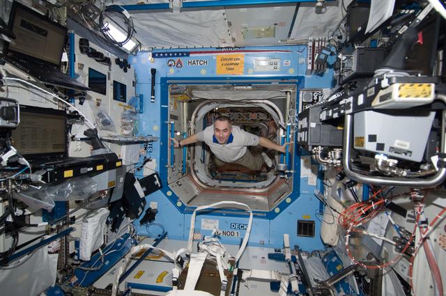 NASA image: Tarelkin floats through hatch into the U.S. Laboratory
