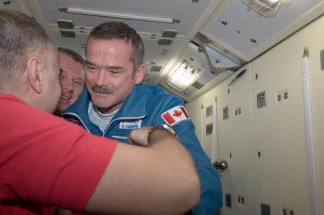 NASA image: Hadfield greets Novitskiy and Tarelkin