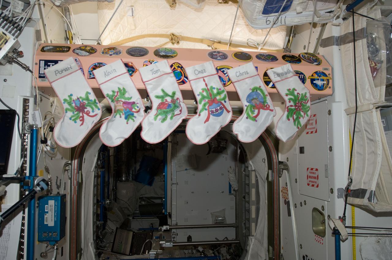 ISS034-E-009737 (25 Dec. 2012) --- Stockings were obviously hung with care on Christmas Day aboard the International Space Station, but for some reason, the fireplace stand-in on Unity couldn't support a real fire. This minor detail didn't faze the spirit of the recently reunited crew members, however. The individual names of the six Expedition 34 crew members are inscribed on their respective stockings. The scene is actually in Node 1, called Unity, which was the first U.S.-built element of the International Space Station that was launched, and it connects the U.S. and Russian segments of the orbital outpost.
