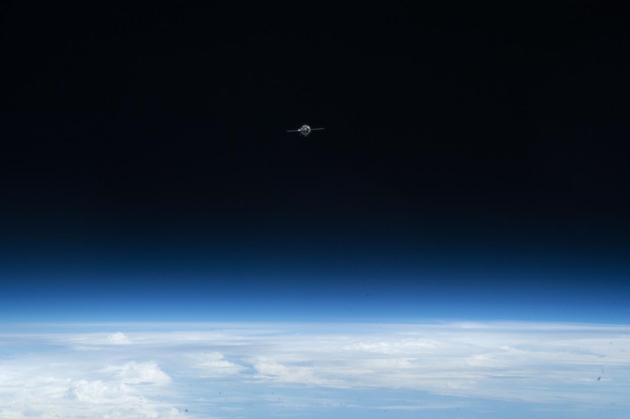 ISS034-E-010172 (21 Dec. 2012) --- As the International Space Station and Soyuz  TMA-07M spacecraft were making their relative approaches on Dec. 21, one of the Expedition 34 crew members on the orbital outpost captured this photo of the distant Soyuz, which appears very small in the frame. Inside the arriving spacecraft were astronaut Chris Hadfield of the Canadian Space Agency, cosmonaut Roman Romanenko of Russia's Federal Space Agency and NASA astronaut Tom Marshburn.