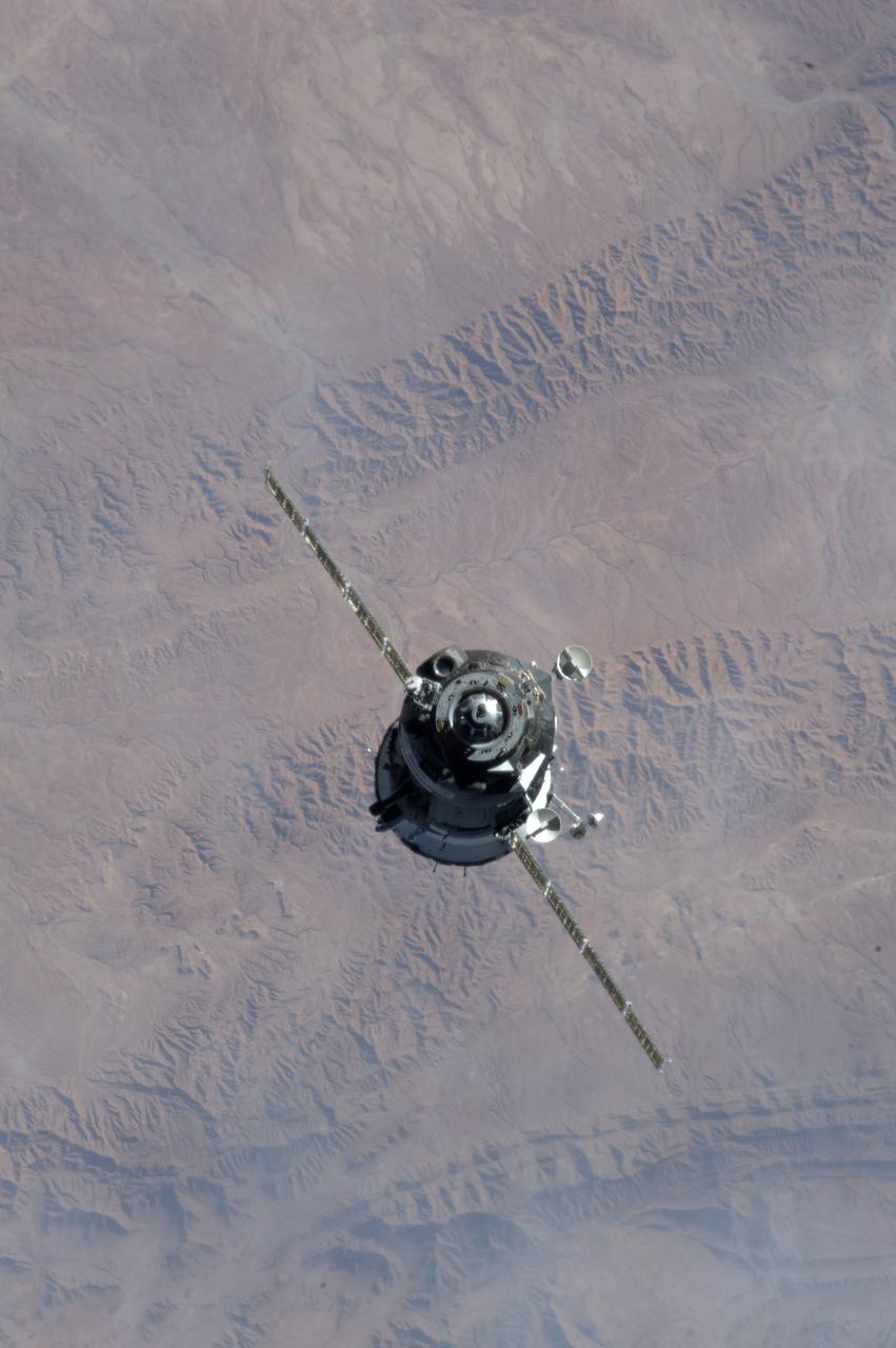 ISS034-E-010181 (21 Dec. 2012) --- As the International Space Station and Soyuz  TMA-07M spacecraft were making their relative approaches on Dec. 21, one of the Expedition 34 crew members on the orbital outpost captured this photo of the Soyuz. The background is in northern Algeria, near the Atlas Mountains. Inside the arriving spacecraft were astronaut Chris Hadfield of the Canadian Space Agency, cosmonaut Roman Romanenko of Russia's Federal Space Agency and NASA astronaut Tom Marshburn.