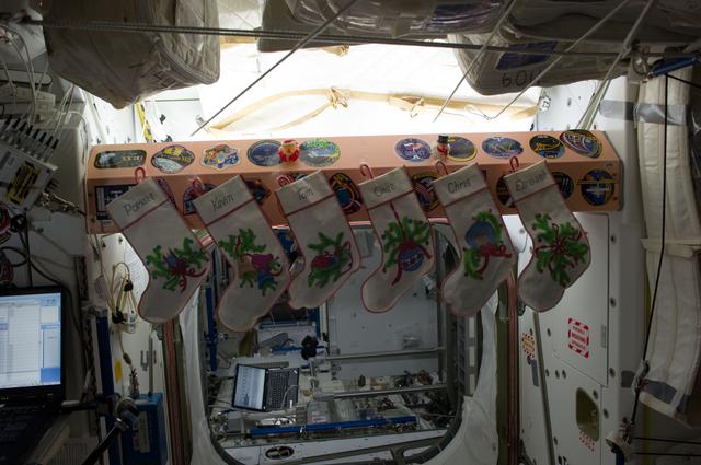 NASA image: Christmas stockings hanging in the Node 1 hatch