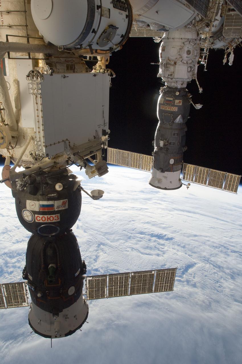 View of Soyuz Spacecraft connected to the Mini Research Module 1 MRM1), and Progress Spacecraft connected to the Pirs Docking Compartment 1 (DC1).  Photo was taken during Expedition 34.