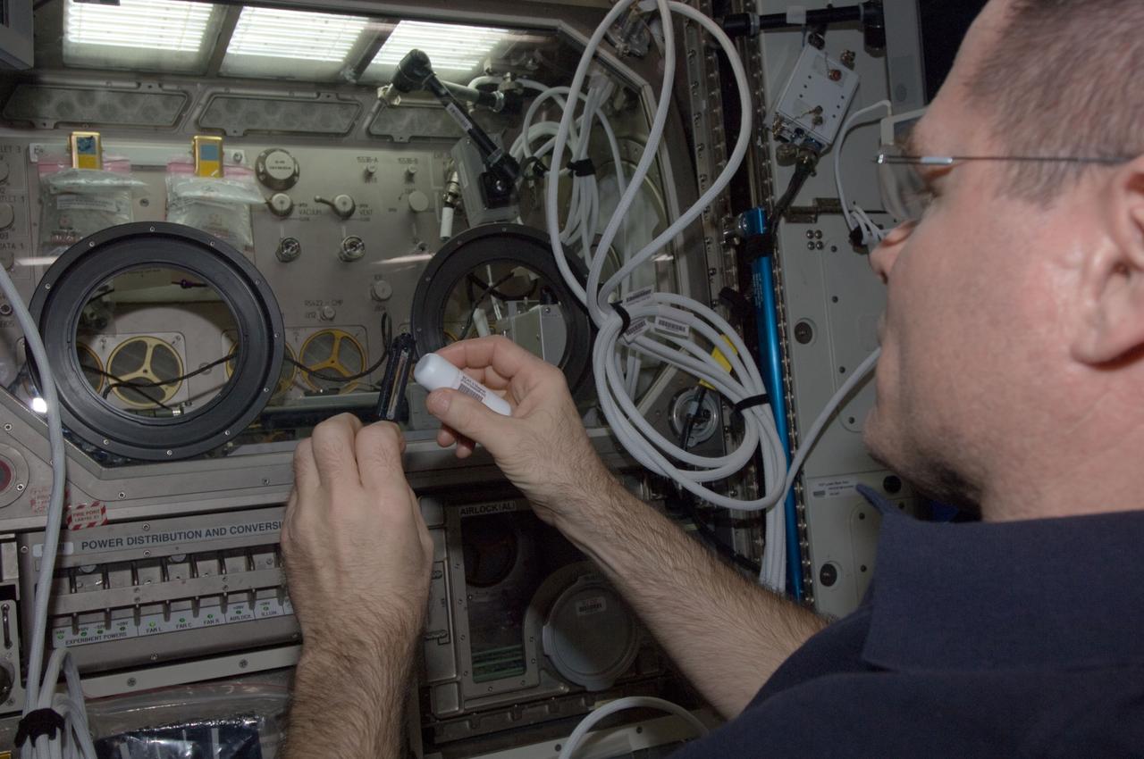 ISS034-E-010876 (28 Dec. 2012) --- NASA astronaut Kevin Ford, Expedition 34 commander, works near the Microgravity Science Glovebox (MSG) in the Destiny laboratory of the International Space Station.