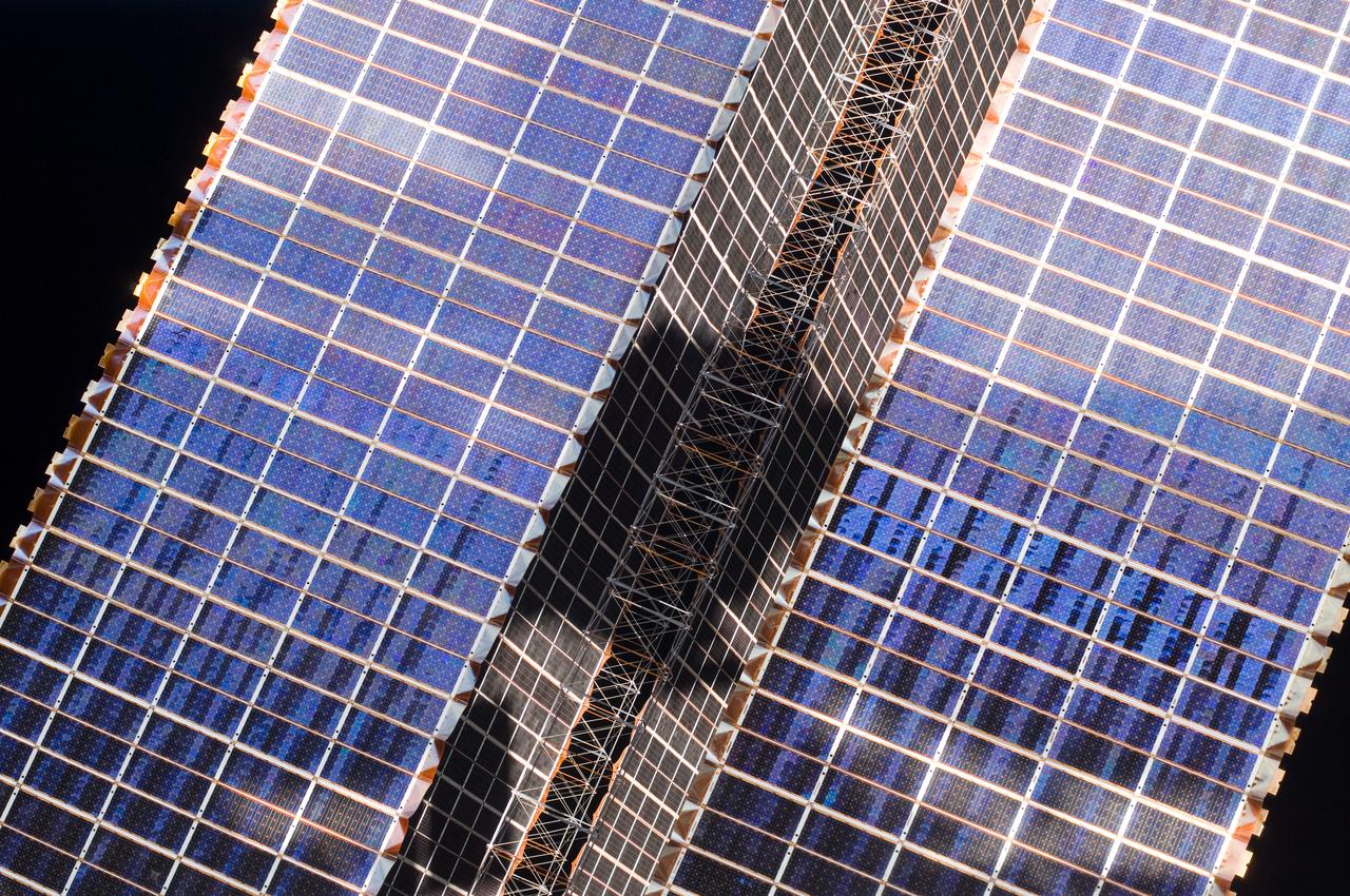 View of Solar Array Wings (SAWs).  Photo was taken during Expedition 34.