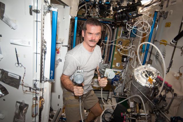 NASA image: Hadfield during WHC maintenance in the Node 3