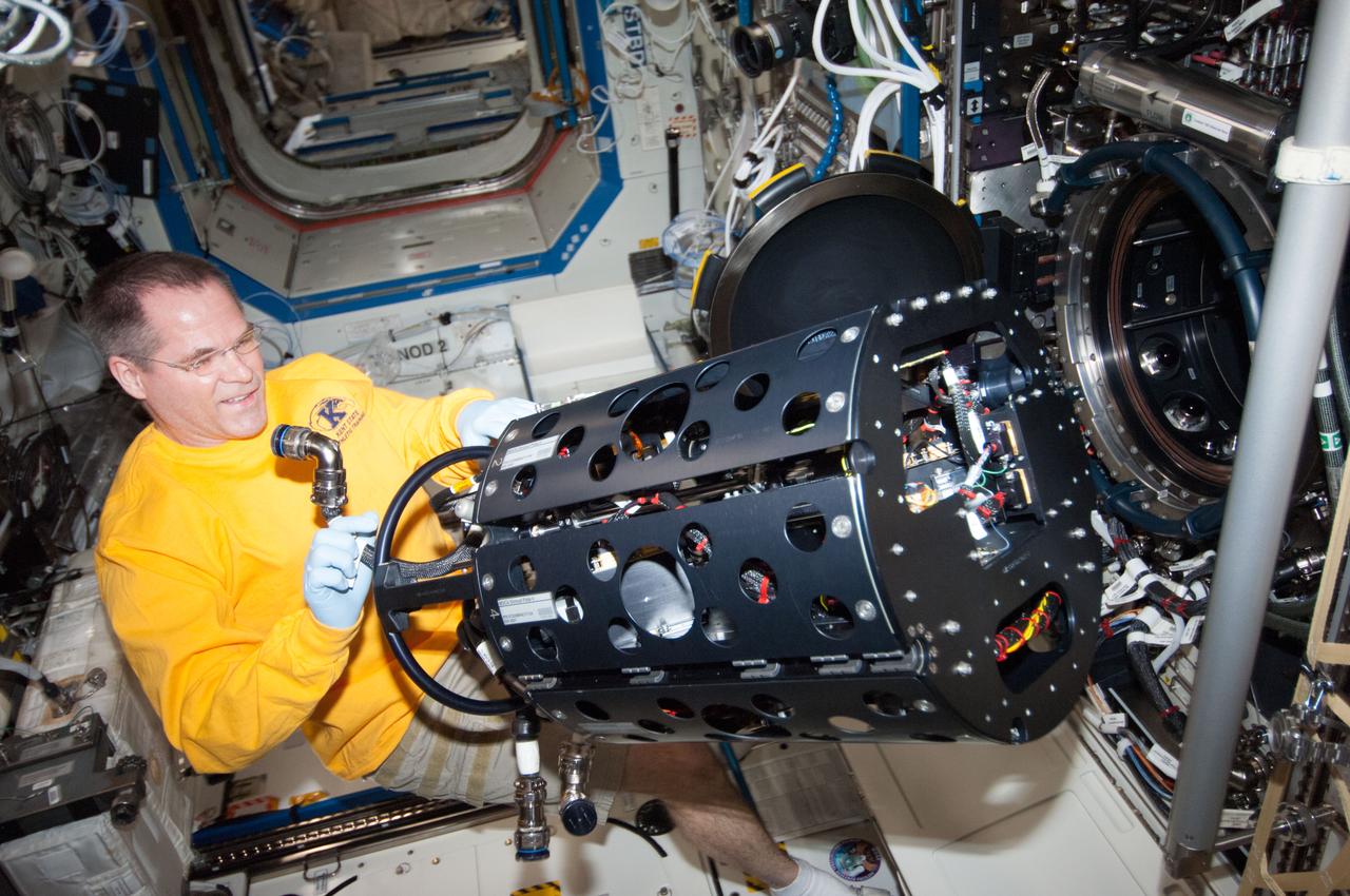 ISS034-E-023544 (9 Jan. 2013) --- NASA astronaut Kevin Ford, Expedition 34 commander, works with the Combustion Integrated Rack (CIR) Multi-user Droplet Combustion Apparatus (MDCA) in the International Space Station's Destiny laboratory.