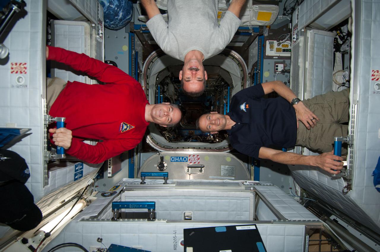 ISS034-E-026598 (22 Dec. 2012) --- NASA astronaut Kevin Ford (left), Expedition 34 commander; along with Canadian Space Agency astronaut Chris Hadfield (center) and NASA astronaut Tom Marshburn, both flight engineers, pose for a photo in the Harmony node of the International Space Station.
