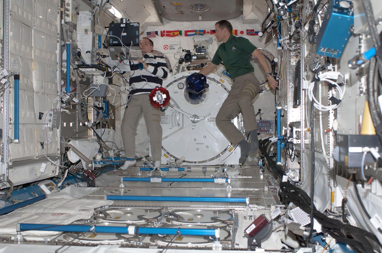 ISS034-E-028342 (11 Jan. 2013) --- NASA astronauts Kevin Ford (left), Expedition 34 commander; and Tom Marshburn, flight engineer, conduct a session of the Synchronized Position Hold, Engage, Reorient, Experimental Satellites Zero Robotics (SPHERES ZR)  program in the Kibo laboratory of the International Space Station.