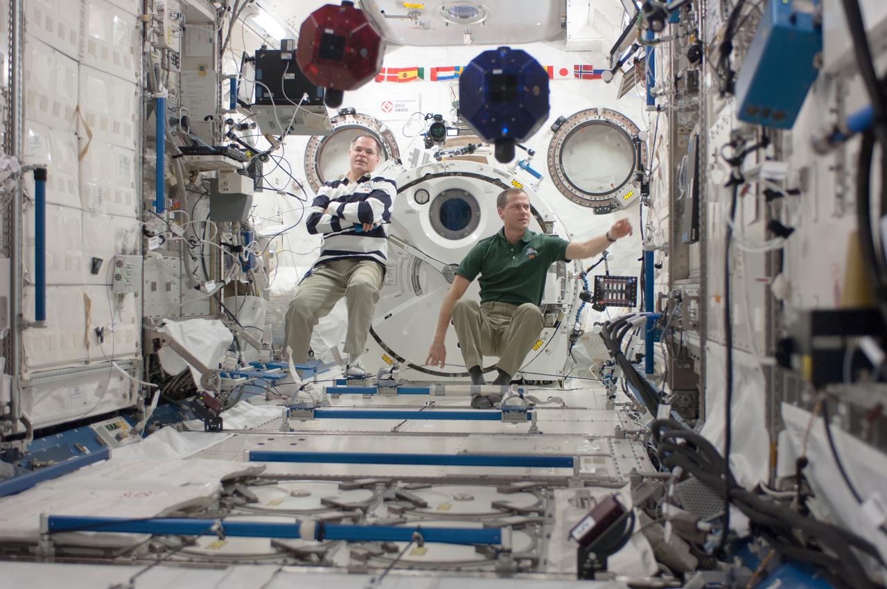 ISS034-E-028409 (11 Jan. 2013) --- With their feet anchored in floor restraints, NASA astronauts Kevin Ford (left), Expedition 34 commander; and Tom Marshburn, flight engineer, conduct a session of the Synchronized Position Hold, Engage, Reorient, Experimental Satellites Zero Robotics (SPHERES ZR)  program in the Kibo laboratory of the International Space Station.