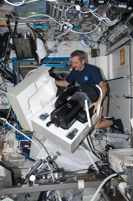 NASA image: Hadfield prepares to set up the ISERV in the U.S. Laboratory