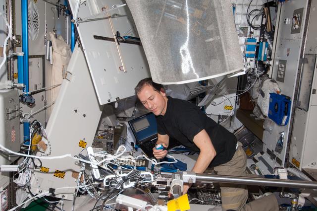 NASA image: Marshburn updates software on the WHC UPA in the Node 3