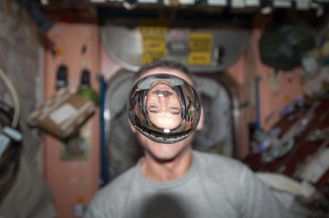 NASA image: Hadfield watches a water bubble float freely in the Node 1