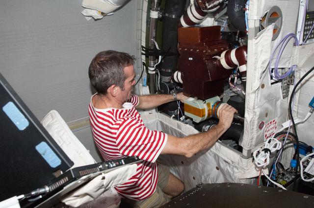 NASA image: Hadfield removes the WTSM and installs the WOOV in the Columbus Module