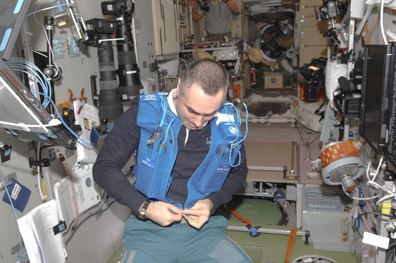 ISS034-E-033718 (24 Jan. 2013) --- Russian cosmonaut Evgeny Tarelkin, Expedition 34 flight engineer, prepares for the Typologia experiment in the Zvezda Service Module of the International Space Station. This experiment studies the crew member's psychophysical state and ability to perform and communicate under stress.