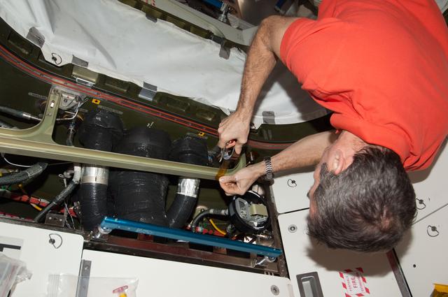 NASA image: Hadfield installs a UBNT sensor in the U.S. Laboratory