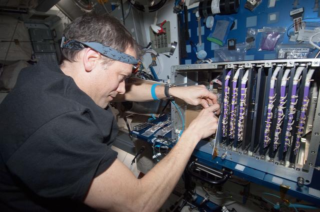 NASA image: Marshburn performs in-flight maintenance to APS in the U.S. Laboratory