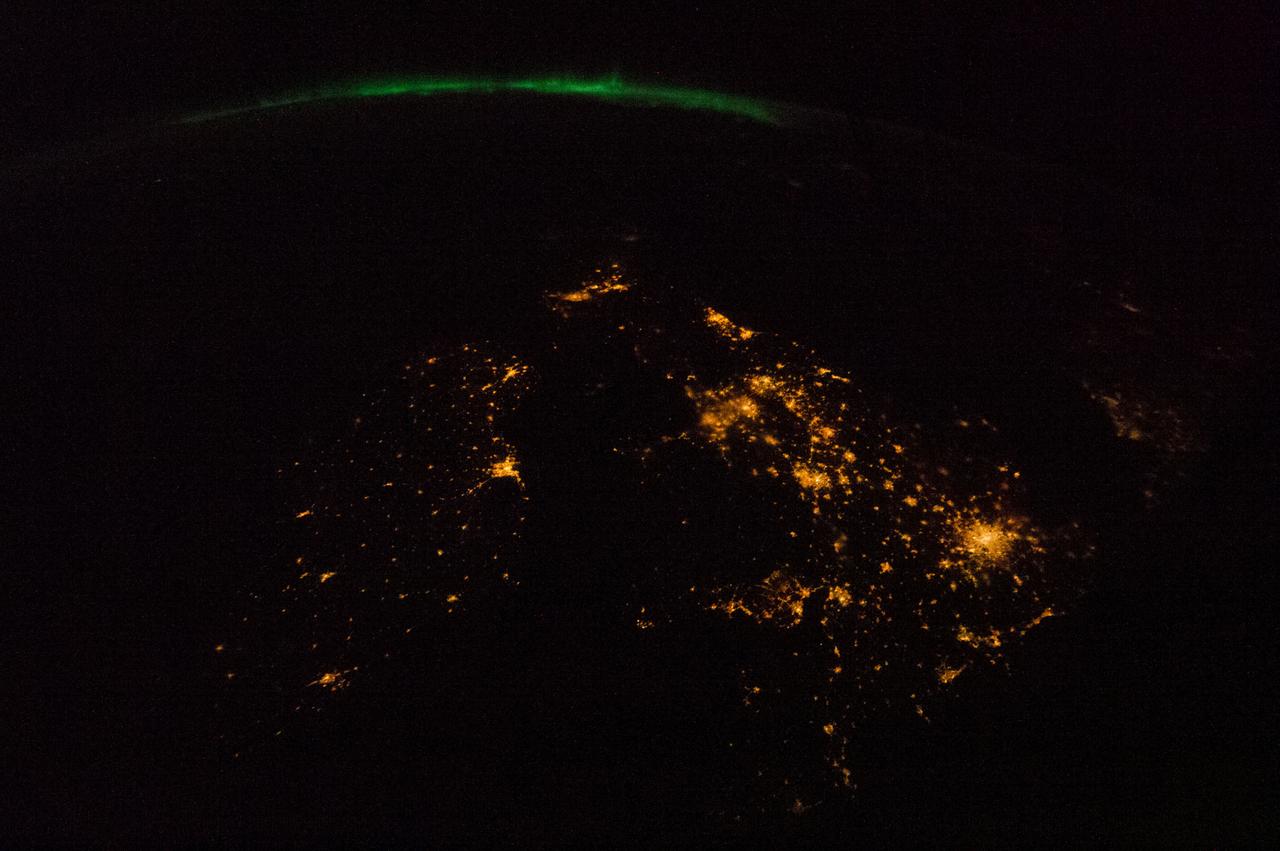 ISS034-E-050137 (14 Feb. 2013) --- One of the Expedition 34 crew members aboard the International Space Station recorded this night image of the British Isles. The view is to the north with Dublin, Ireland left of center. London appears as the bright cluster of lights centered in the lower right quadrant. The green appearance along the horizon is the Aurora Borealis or Northern Lights.
