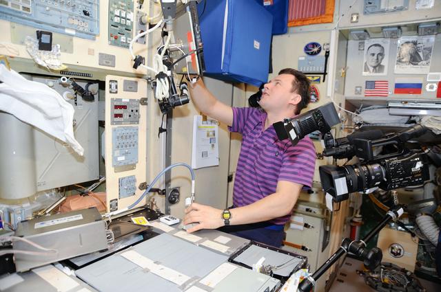 NASA image: Romanenko works with the Electronic Nose (Enose) Hardware in the SM