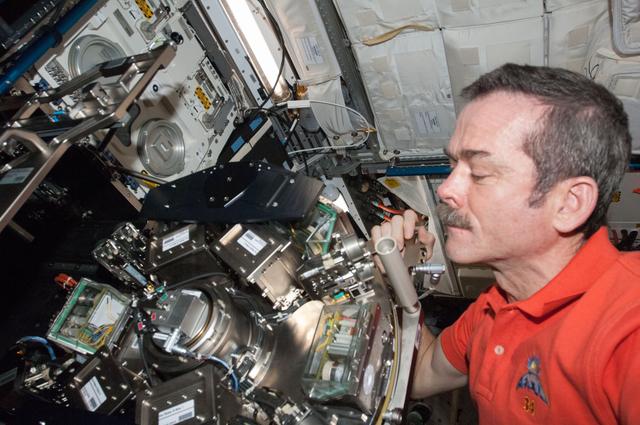 Hadfield performs regular maintenance on Biolab, in the Columbus Module