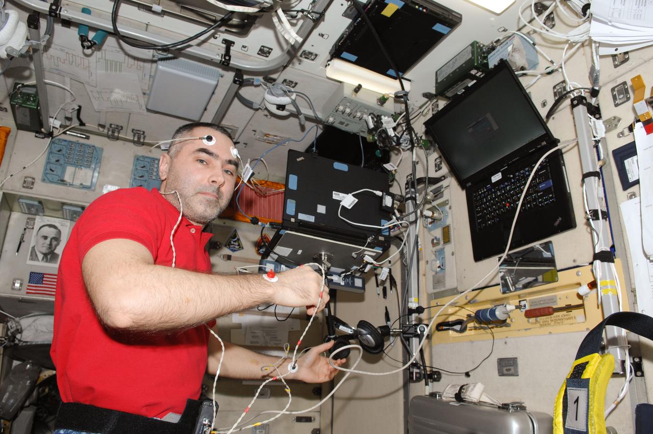 iss034e061633 (3/6/2013) --- Cosmonaut Evgeny Tarelkin, Flight Engineer (FE) conducting Sprut-2 Experiment run, in the Service Module (SM) aboard the International Space Station (ISS). The Study of Changes in Body Composition and Distribution of Fluids Within the Human Body During Long-term Spaceflight (Sprut-2) studies the change in body composition and fluid distribution in the human body during long-term spaceflight in order to evaluate adaptation mechanisms and improve countermeasures.