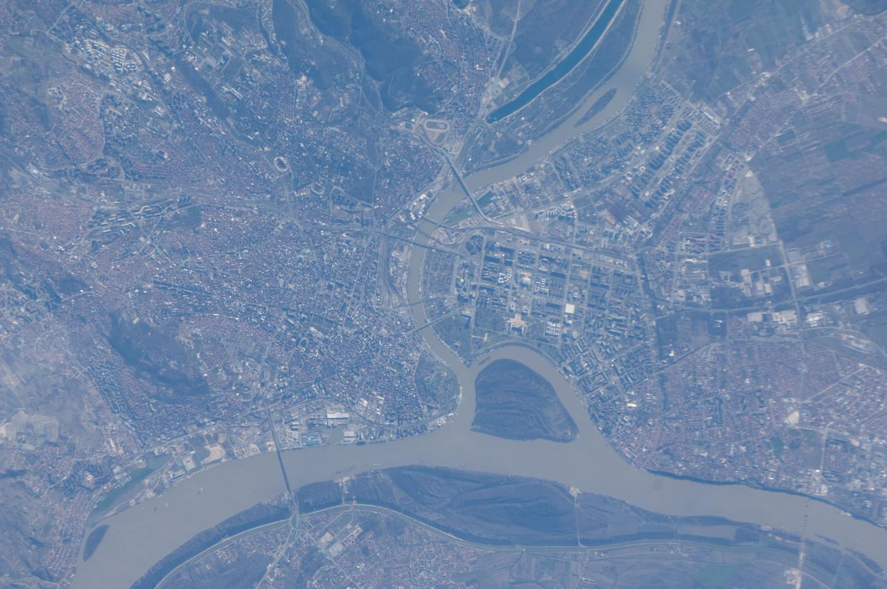 ISS034-E-61717 (5 March 2013) --- One of the Expedition 34 crew members aboard the Earth-orbiting International Space Station captured this image of Belgrade, the capital city of the Republic of Serbia. Located at the confluence of the Danube and Sava Rivers, the Belgrade metropolitan area has a population of 1.65 million (2011 census information) which ranks it as one of the largest such areas in southeastern Europe. Human occupation of the Belgrade area can be traced back over 6000 years. According to historical reports, a city that eventually became Belgrade existed by at least 279 BC. The core of old Belgrade – known as Kalemegdan –is located along the right banks of both the Danube and the Sava Rivers (image center). To the west across the Sava, Novi Beograd (New Belgrade) was constructed following World War II. The photograph was acquired on March 5, 2013 with a digital camera using the equivalent of a 700 millimeter lens.