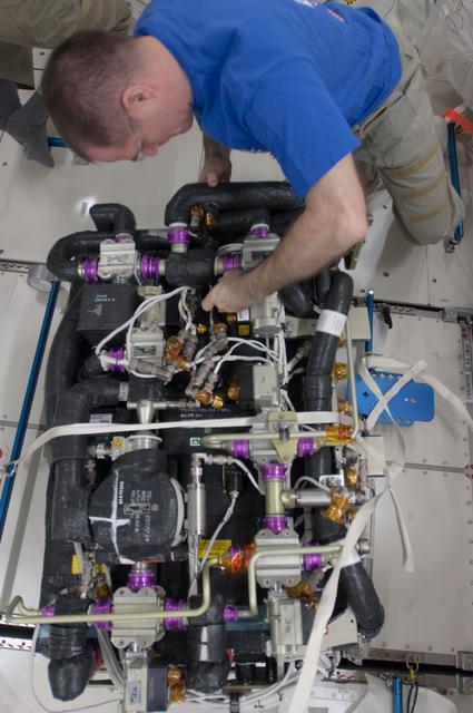 NASA image: Ford performs maintenance on the CDRA in the JPM