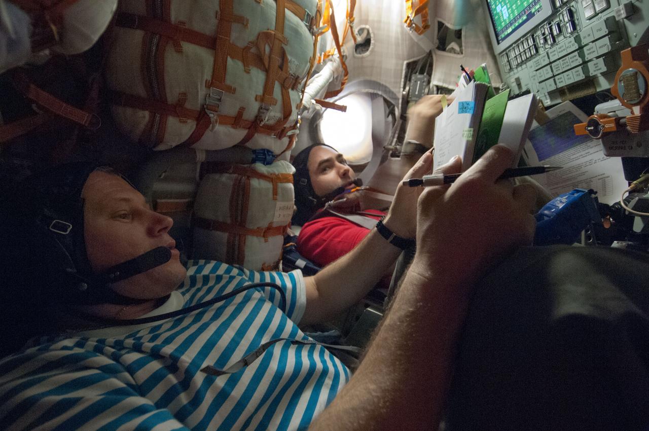 ISS034-E-066640 (11 March 2013) ---  Russian cosmonauts Oleg Novitskiy (foreground), and Evgeny Tarelkin, both Expedition 34 flight engineers,  participate in descent training in the Soyuz TMA-06M spacecraft, which is docked to the International Space Station. Undocking and landing are scheduled for March 16, Kazakh time.