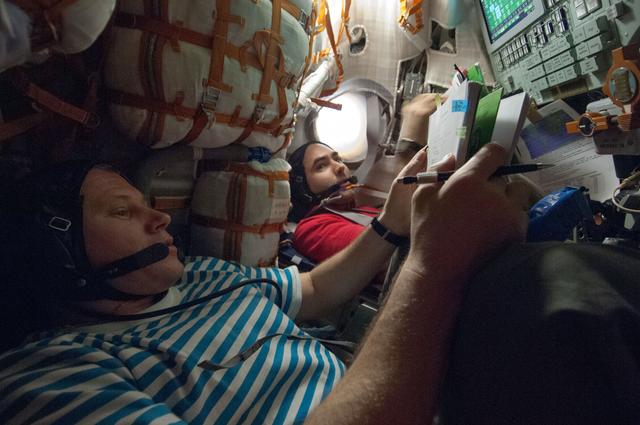 NASA image: Novitskiy and Tarelkin during descent training in the Soyuz TMA-06M spacecraft