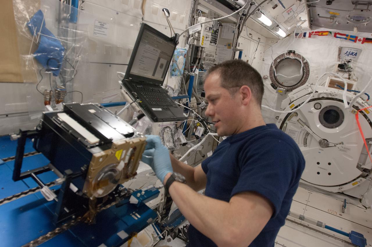 ISS035e006147 (19 March 2013) --- NASA astronaut Tom Marshburn, Expedition 35 flight engineer, works on the Marangoni Inside core cleaning in the Kibo Japanese Experiment Module onboard the Earth-orbiting International Space Station. Marangoni convection is the flow driven by the presence of a surface tension gradient which can be produced by temperature difference at a liquid/gas interface. The convection in liquid bridge of silicone oil is generated by heating the one disc higher than the other. Scientists are observing flow patterns of how fluids move to learn more about how heat is transferred in microgravity.