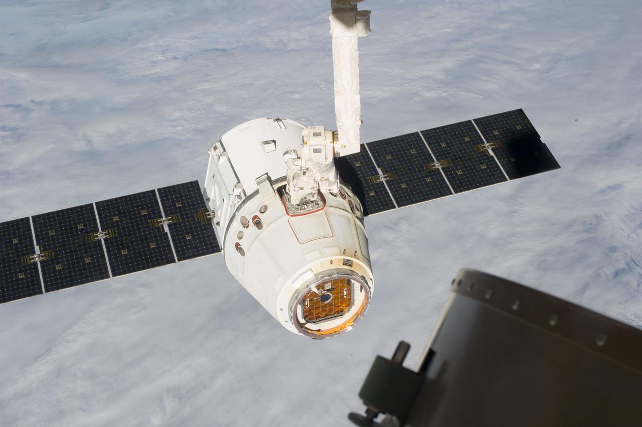 ISS035-E-012425 (26 March 2013) --- This image is one of a series of still photos documenting the process to release the SpaceX Dragon-2 spacecraft from the International Space Station on March 26.  The spacecraft, filled with experiments and old supplies, can be seen in the grasp of the Space Station Remote Manipulator System’s robot arm or CanadArm2 after it was undocked from the orbital outpost. The Dragon was scheduled to make a landing in the Pacific Ocean, off the coast of California, later in the day.