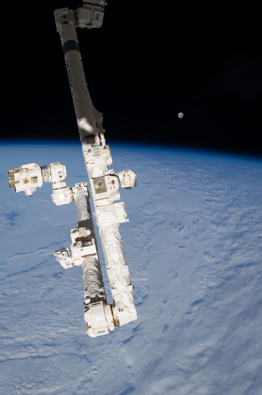 Earth observation taken by the Expedition 35 crew aboard the ISS. The Moon and Canadarm2 Space Station Remote Manipulator System (SSRMS) are in view.