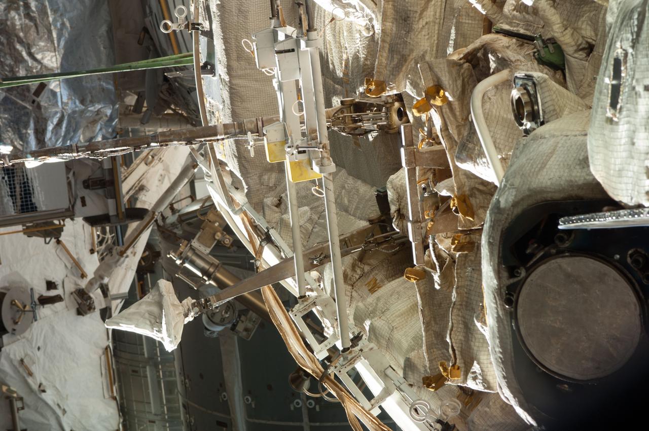 Survey view of a portion of the Zarya Functional Cargo Block (FGB) taken through a window in the Russian segment of the ISS during Expedition 35. Portions of the S0 and Z1 Truss segments are also in view.