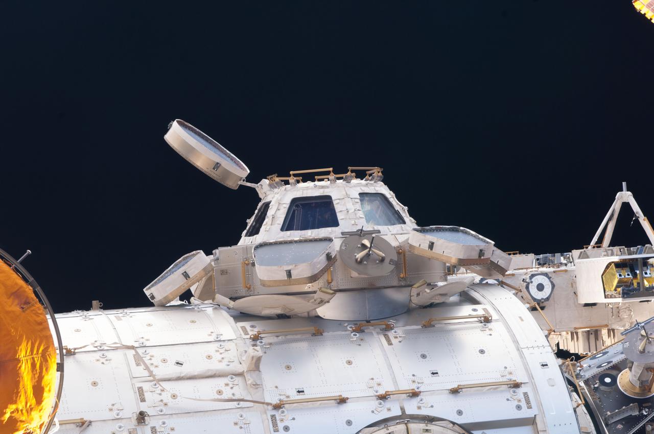 Survey view of portions of the Cupola Module, Tranquility Node 3, and Pressurized Mating Adapter 3 (PMA-3). Image was taken through a window in the Russian segment of the ISS during Expedition 35.