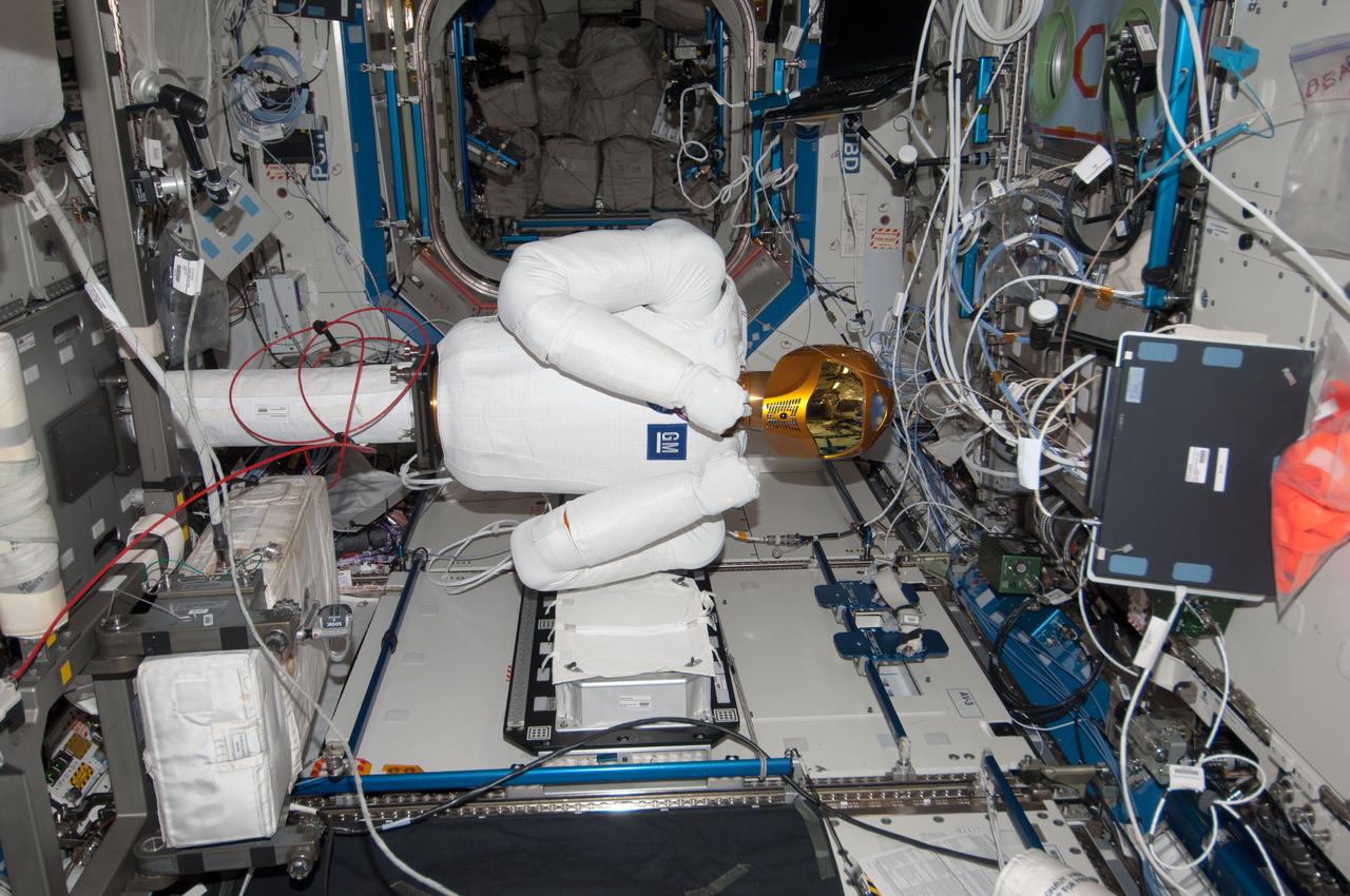 ISS035-E-016453 (9 April 2013) ---  R-2 is busy in U.S. lab Destiny aboard the Earth-orbiting International Space Station during tele-operation (by ground controllers) to mimic movement of a crew member.