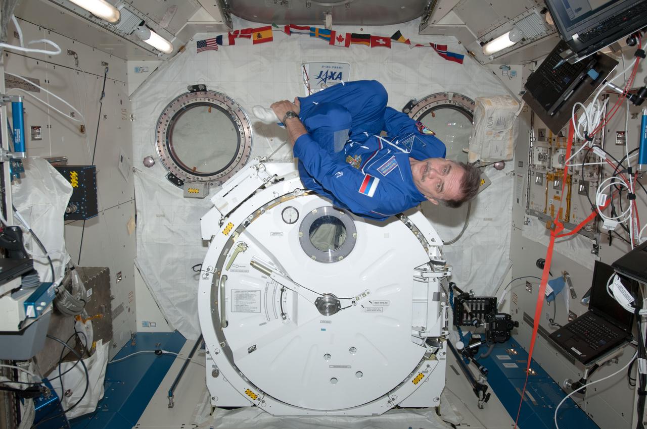 ISS035-E-016582 (6 April 2013) ---  Russian cosmonaut Pavel Vinogradov, Expedition 35 flight engineer, uses some of his personal time onboard the International Space Station to take advantage of the weightless environment to do things he can't do in his living room on Earth. Vinogradov is in the Japan Aerospace Exploration Agency's Kibo lab.